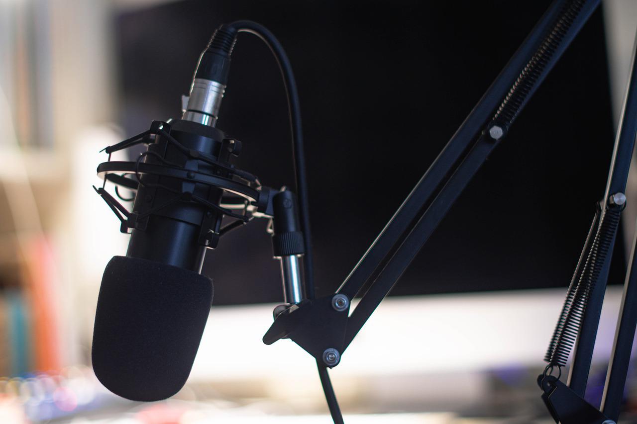 A black microphone on a stand.